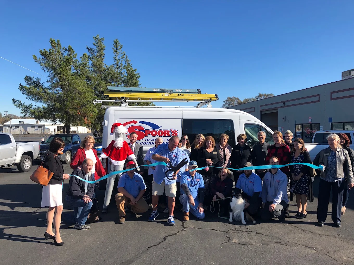 Spoor's Heating & Air team at a ribbon-cutting ceremony