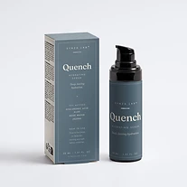 Quench hyaluronic serum bottle and carton on slate blue backdrop with water droplet texture