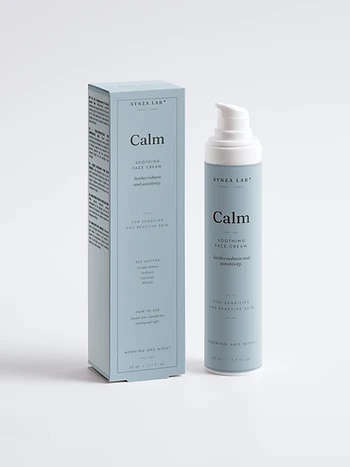 Calm soothing face cream bottle and carton on dusty blue backdrop