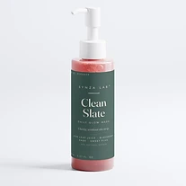 Clean Slate daily glow wash bottle on forest green label with coral gel