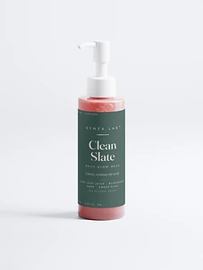 Clean Slate daily glow wash bottle on forest green label with coral gel
