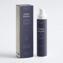 Night Repair ceramide night cream bottle and carton on deep indigo backdrop, night mood