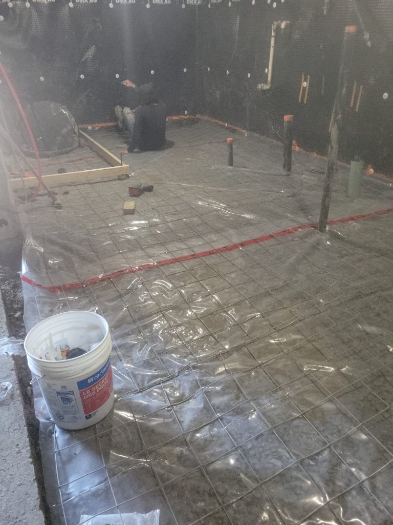 Rebar mesh ahead of a concrete pour, recent basement waterproofing job from around our service area.