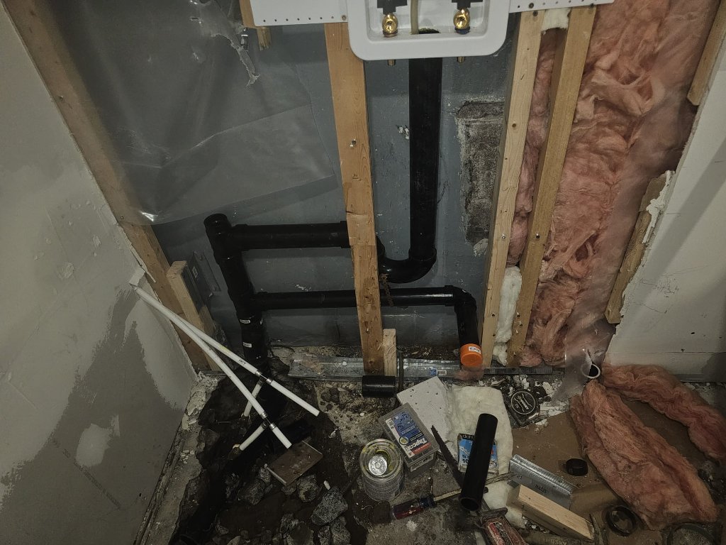 Drain stub-outs and hose bib connections during a repiping job.