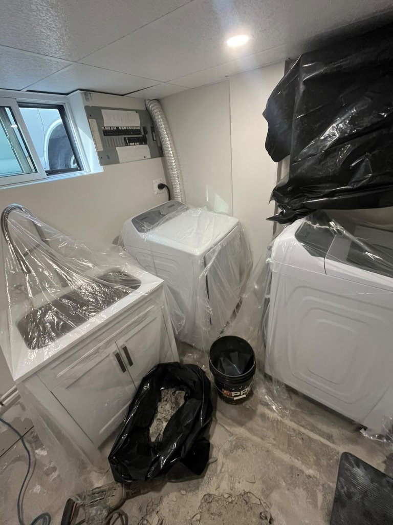 Toilet install with new wax ring as part of a bathroom fixture upgrade.