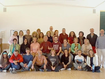 Large community group photo indoors after a training