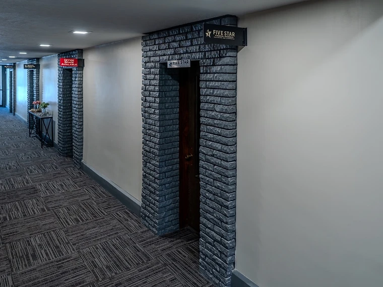 Hallway with charcoal brick archways