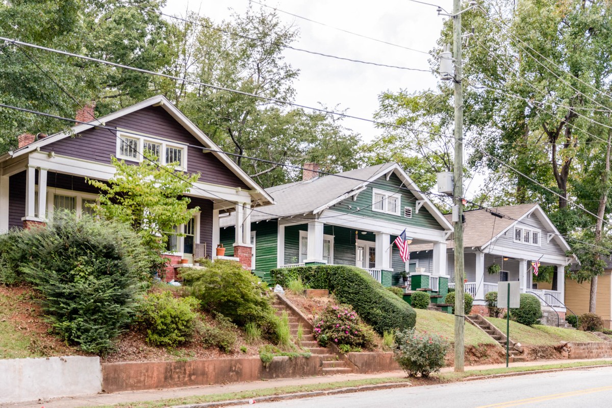 A charming, well-kept neighborhood main street lined with homes and trees