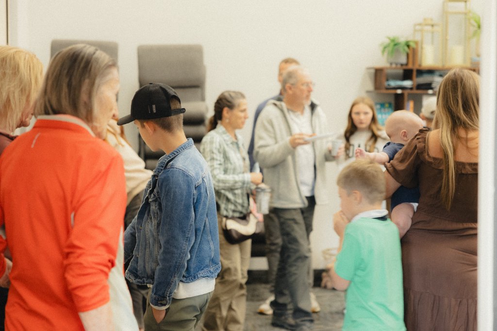 Members of Inheritance Church socializing together at an indoor gathering