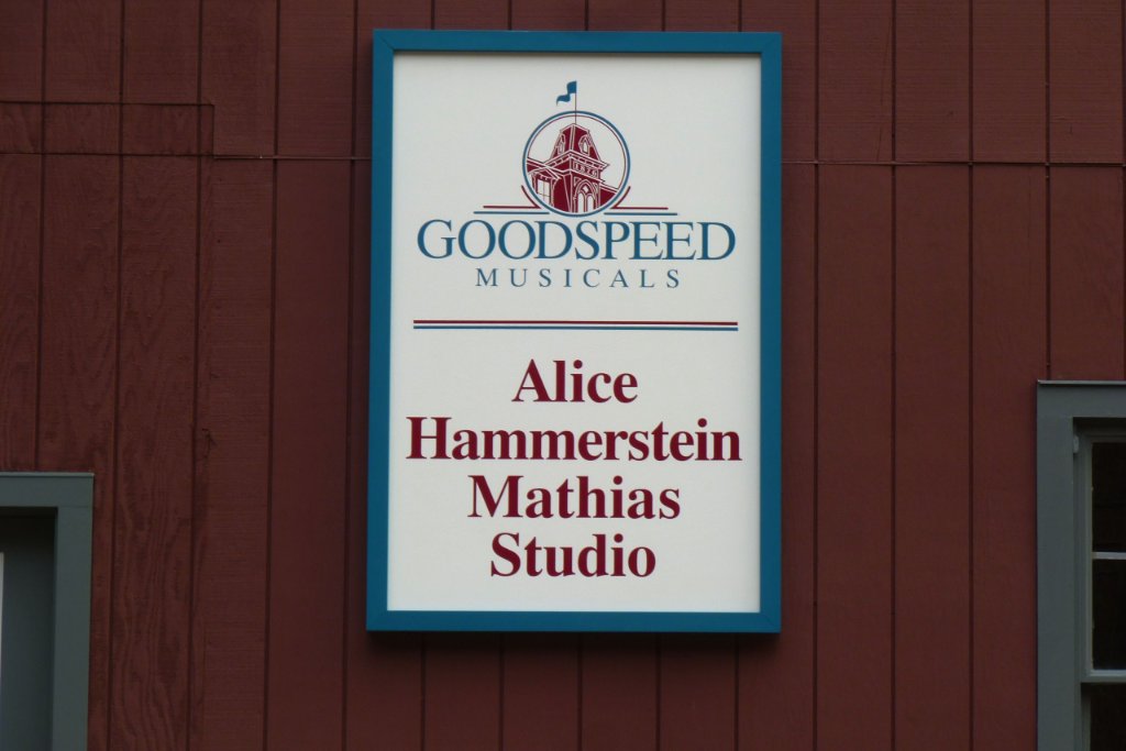 Hand carved wooden business sign for Goodspeed Musicals studio by New England Sign Carvers