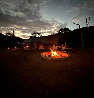 Last light over the camp and firepit