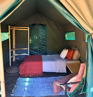 Inside a guest tent: warm, simple and considered