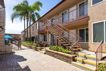Courtyard walkway and units at Tierra del Rey apartments in La Mesa