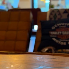 Wooden table with a Harley-Davidson leather lounge chair