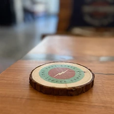 Branded Free State Coffee Co wooden coaster with lightning bolt logo