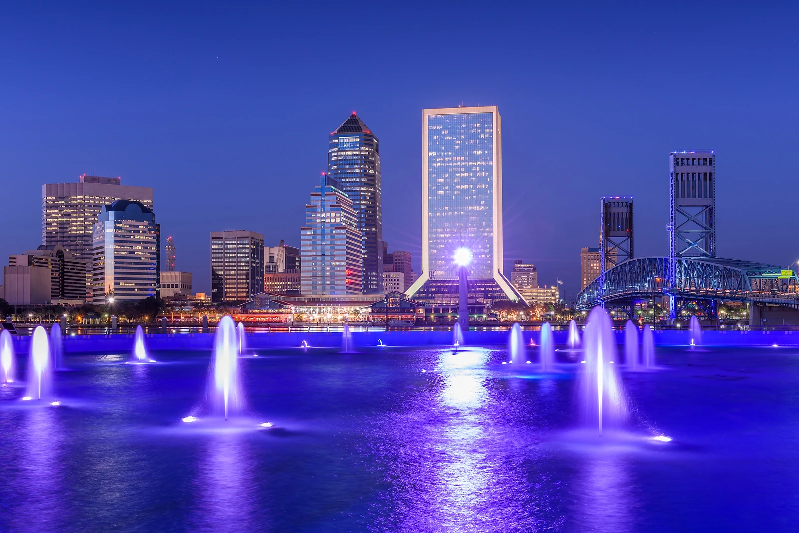 Jacksonville skyline at night with illuminated fountains