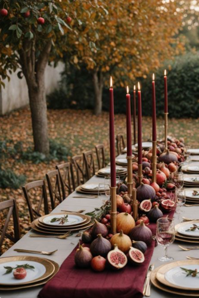 An autumn tablescape with figs, taper candles and a burgundy runner