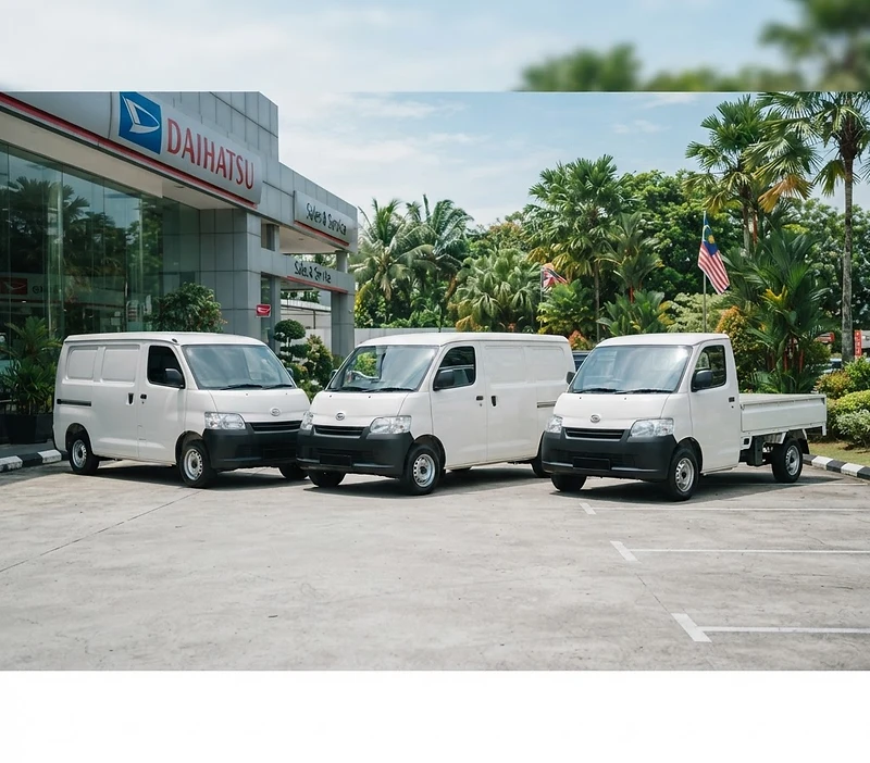 White Daihatsu Gran Max panel vans and pick-up parked outside a Daihatsu showroom
