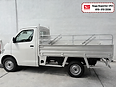White Daihatsu Gran Max Pick-Up with the standard steel cargo body and headboard, side view, Saga Superior (PJ)
