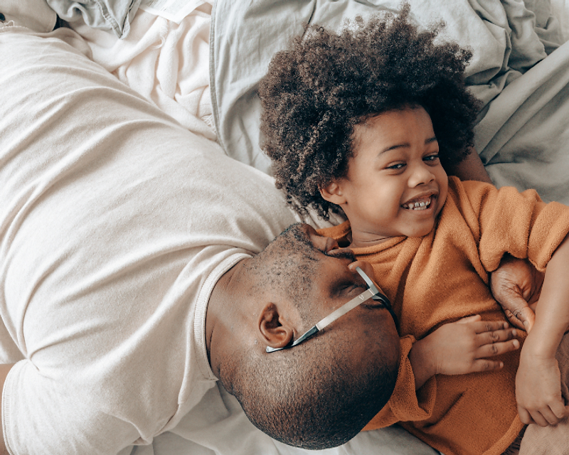 A family sharing a joyful moment together, representing healthier lives within reach
