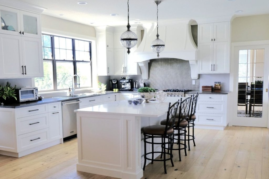 Custom luxury kitchen with white shaker cabinetry designed by Tabinets