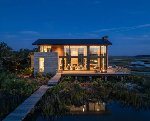 Modern villa overlooking a coastal marsh
