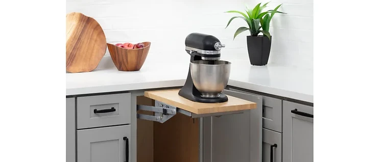 Base cabinet pull-out shelf with mixer lift mechanism holding a KitchenAid stand mixer