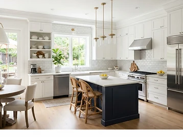 Modern kitchen with white shaker cabinetry and quartz countertops
