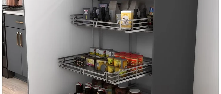 Tall pantry cabinet with pull-out wire basket shelving system holding dry goods and canned items