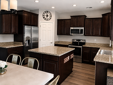 Kitchen with dark wood cabinetry before refresh
