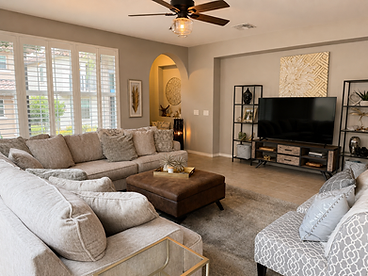 Great room styled with warm textures and natural light
