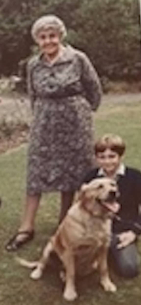 Young Michael Harding, his grandmother, and their golden retriever Friday