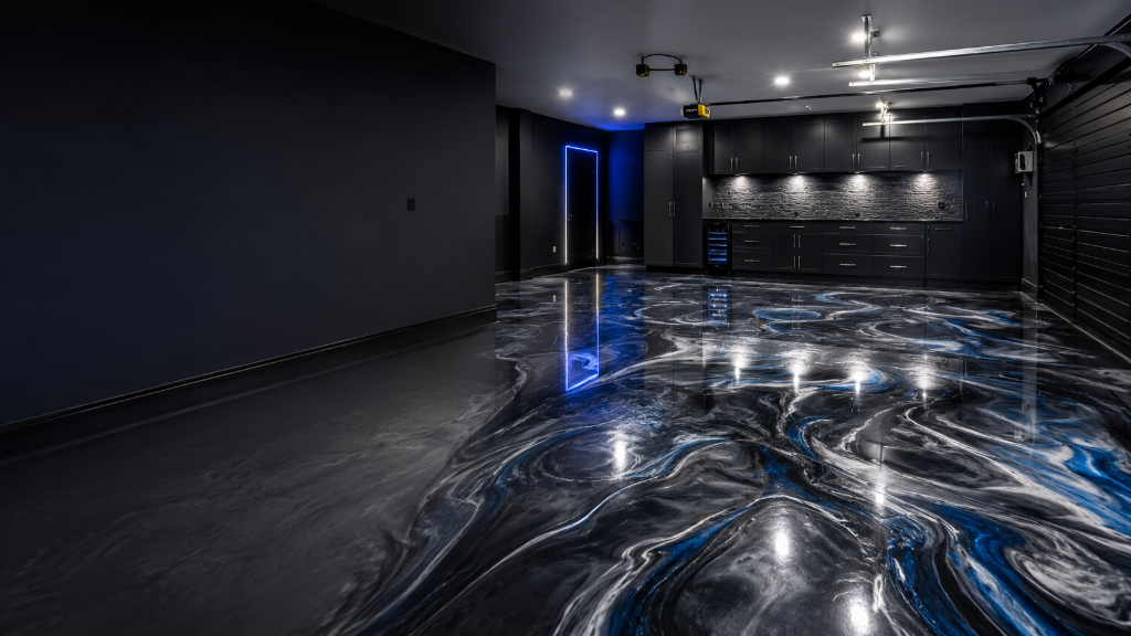 Premium metallic epoxy garage floor with charcoal, white, and electric-blue swirls by Arc Painting Solutions in Houston