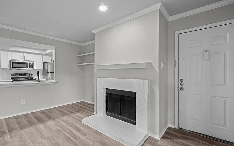 Living room with white grid-tile fireplace painted by Arc Painting Solutions in Spring, TX
