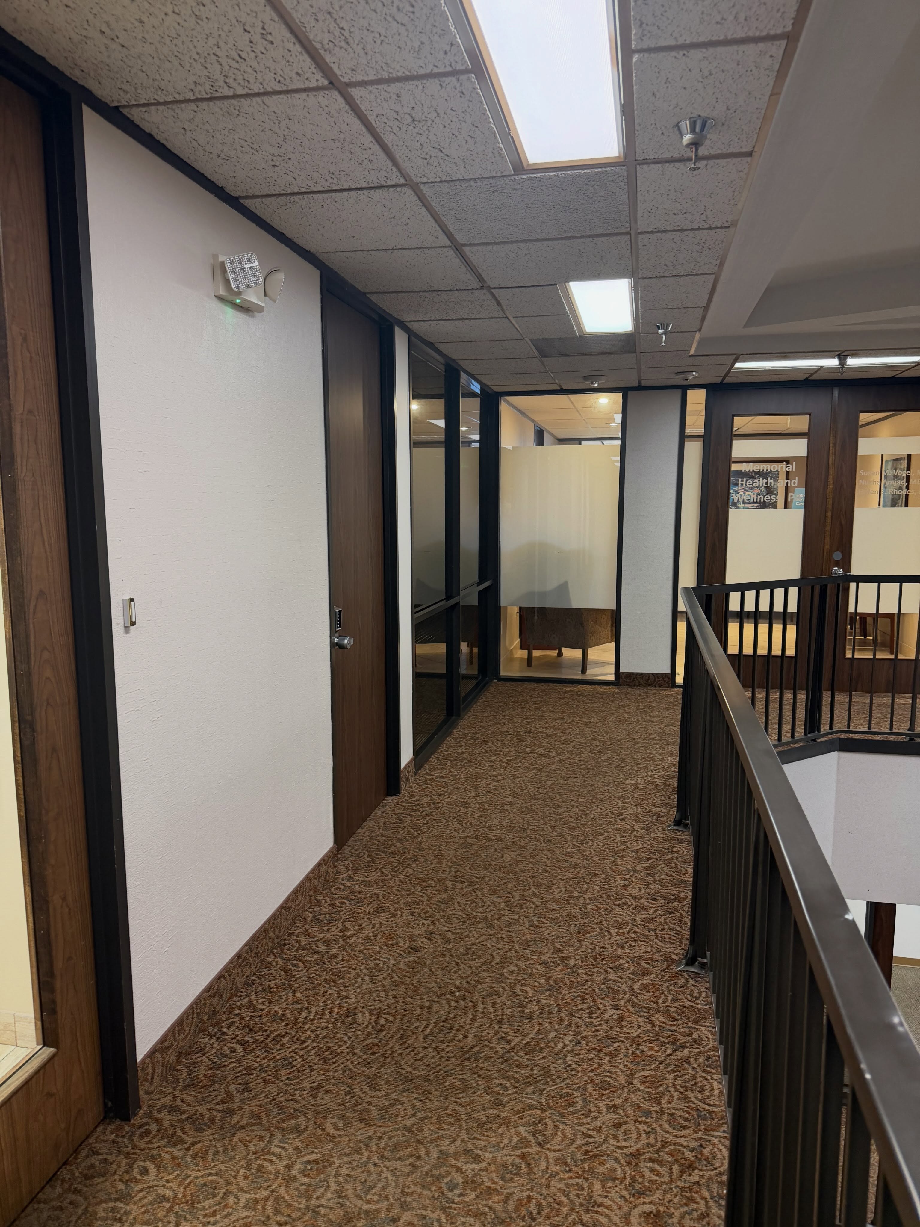 Freshly painted office suite hallway and glass storefronts by Arc Painting Solutions