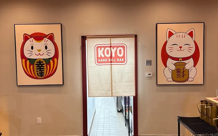 Restaurant interior with a deep-red painted accent stripe and trim at Koyo Hand Roll Bar by Arc Painting Solutions