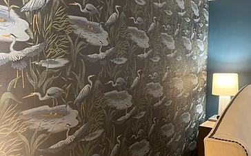 Dark nature-themed heron wallpaper installed by Arc Painting Solutions in a Houston home