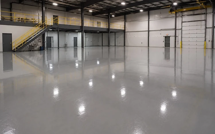 High-gloss industrial epoxy floor in a warehouse installed by Arc Painting Solutions in Houston