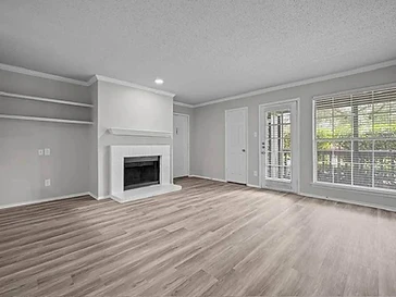 Bright grey living room with fresh white trim after an interior painting project by Arc Painting Solutions