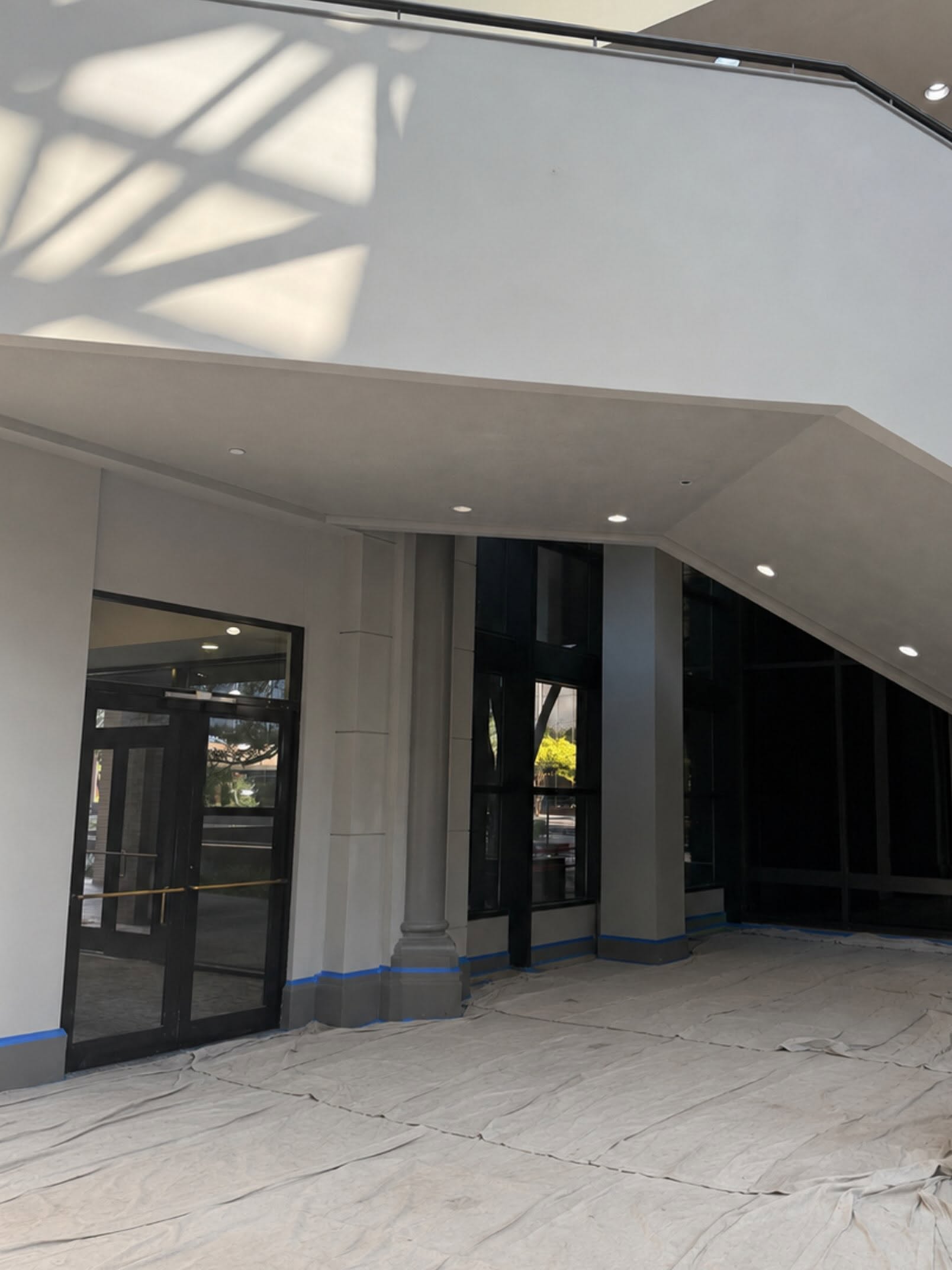 Commercial entry masked and prepped for an interior repaint by Arc Painting Solutions
