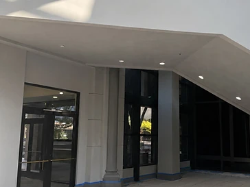 Commercial entry masked with paper and blue tape before painting by Arc Painting Solutions