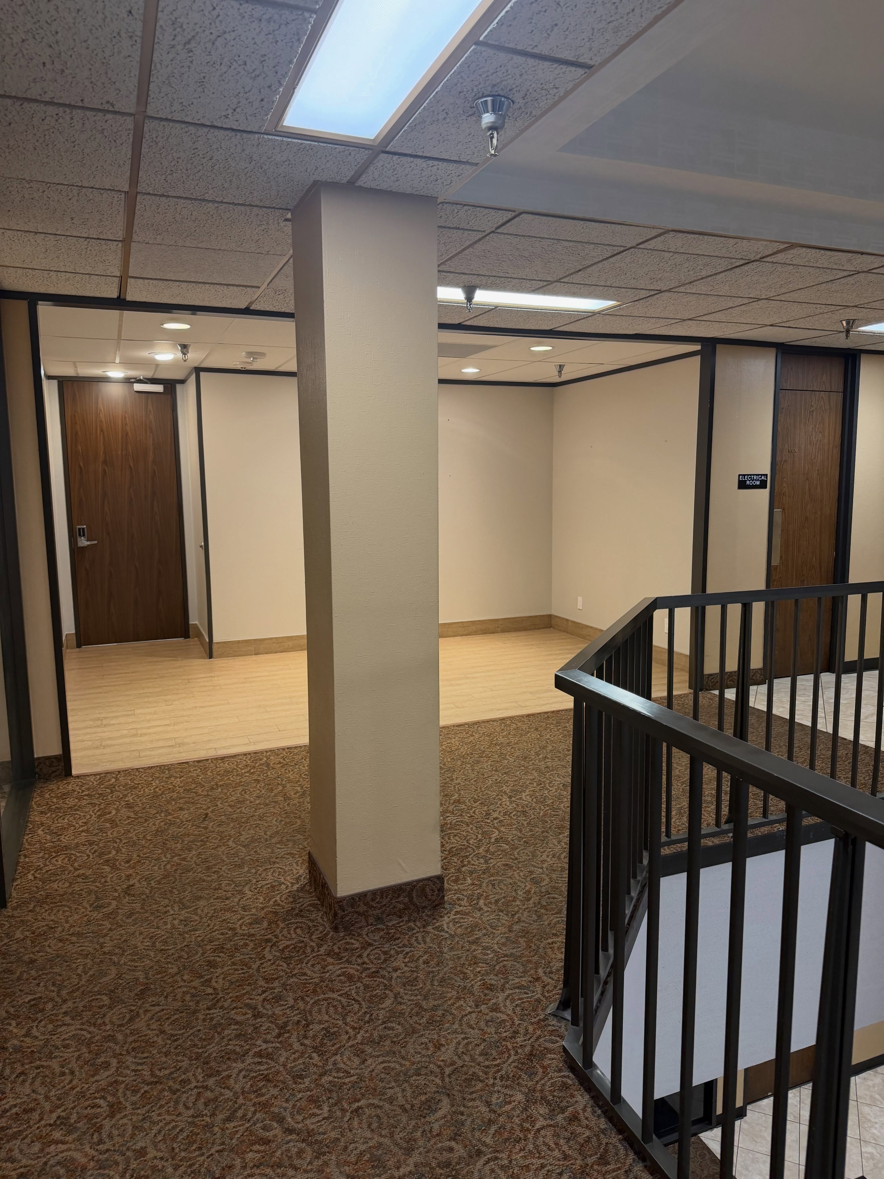 Commercial office corridor with repainted columns and trim by Arc Painting Solutions