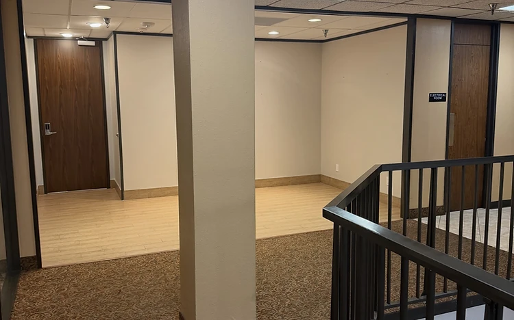 Commercial office corridor with repainted columns and trim by Arc Painting Solutions