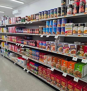 Long grocery shelf stocked with pantry staples