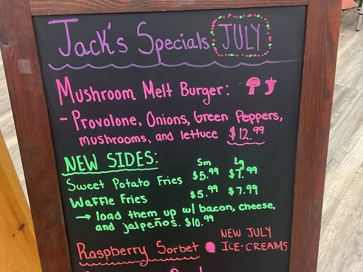 Jack's July specials chalkboard featuring mushroom melt burger and new sides