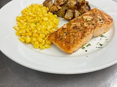 Grilled entrée served with vegetables