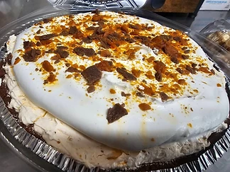 Cream-topped pie in a foil pie pan