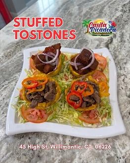 Four stuffed tostones served on a plate at La Casita de la Picadera