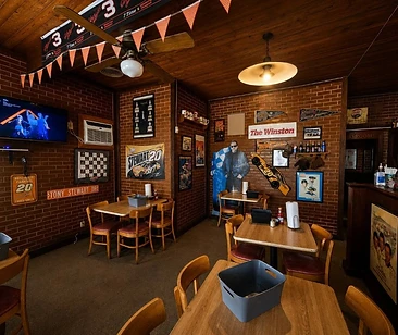 Wood-and-brick dining room with racing memorabilia