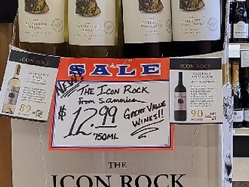 Past in-store Icon Rock promotional display with historical signage; pictured price is not represented as current